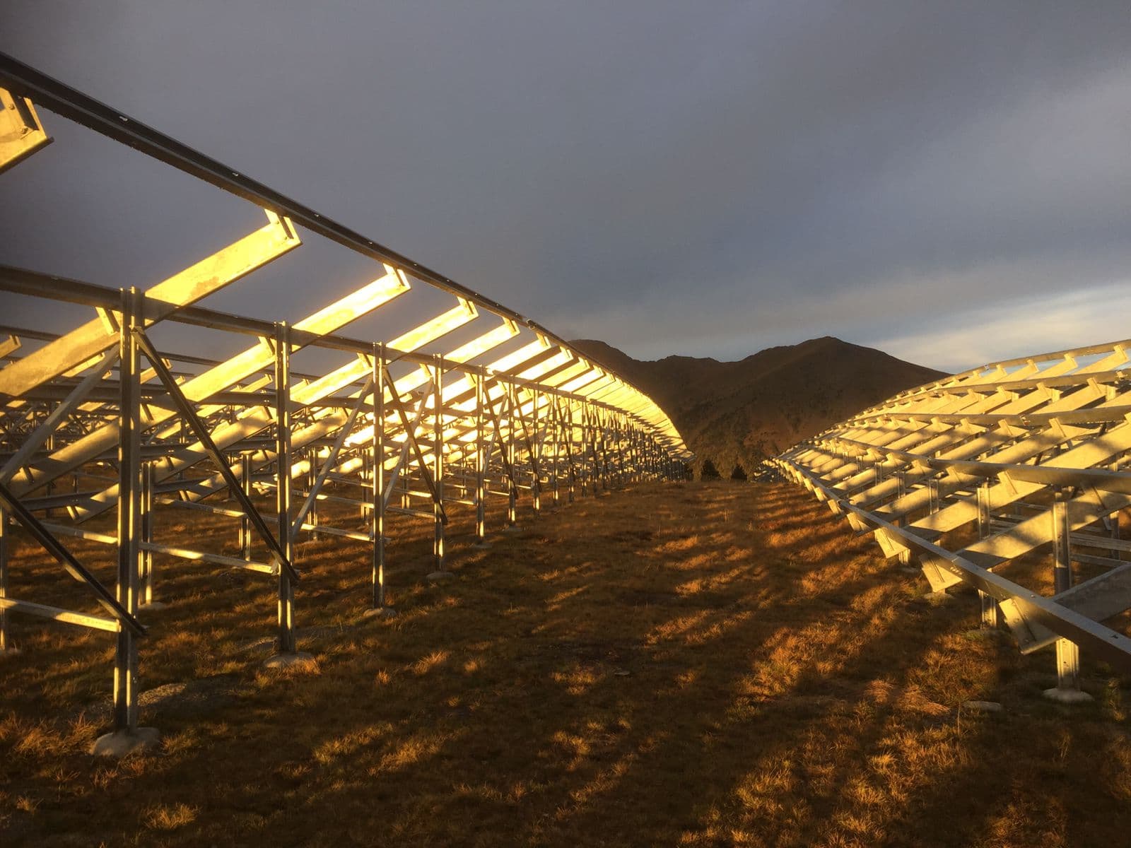 Solar panel structures at golden hour sunset