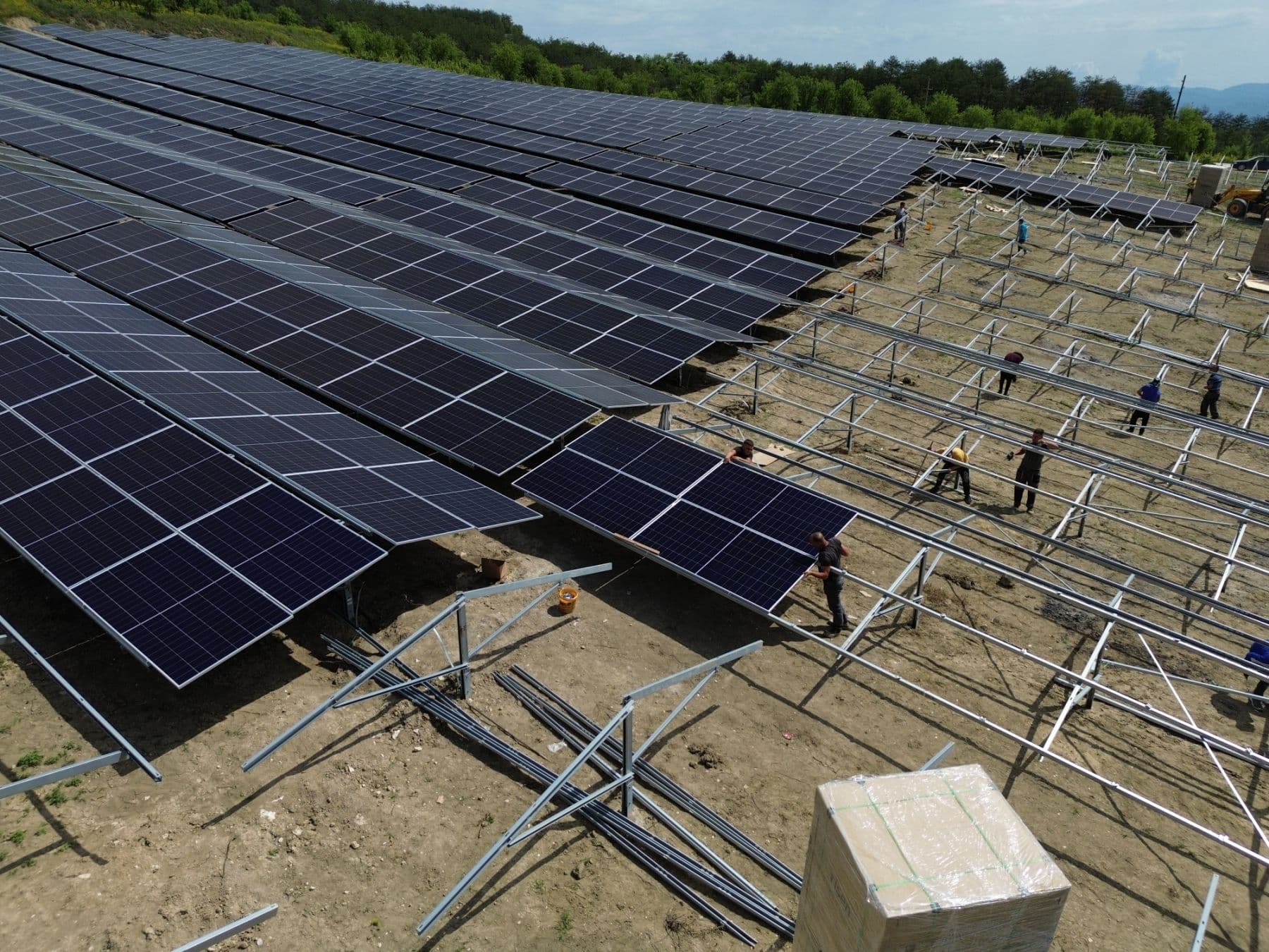MWH Solar workers installing solar panels on a rooftop mounting structure
